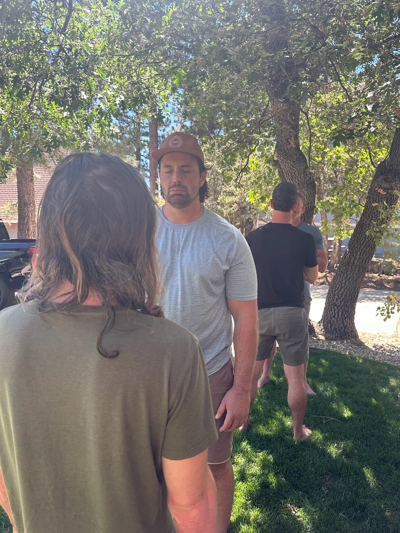 Participants in a group healing session outdoors